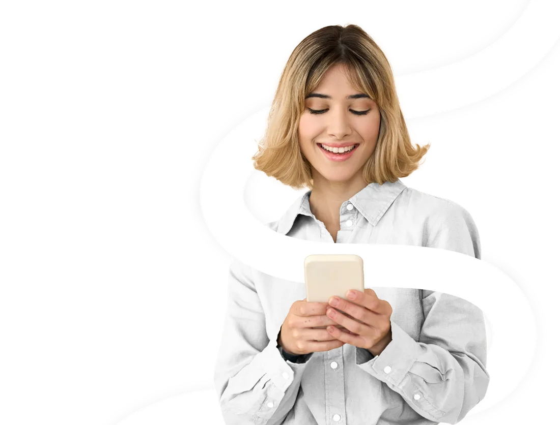 Smiling woman working on her phone
