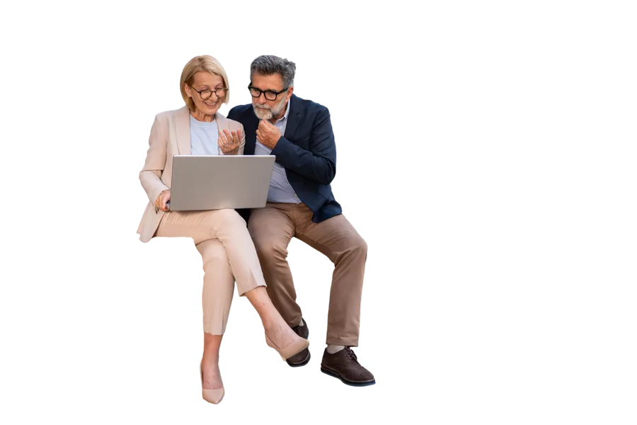 Two colleagues looking at a laptop together